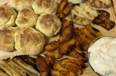 BBQ PEACHES WITH HOMEMADE BISCUITS AND WHIPPED CREAM