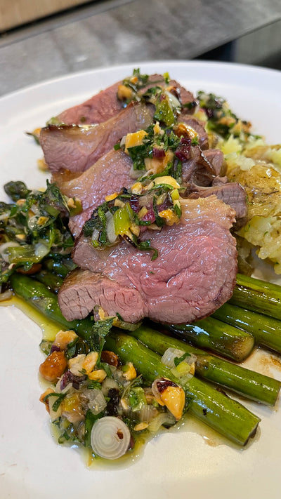 ROASTED LAMB, CRUSHED POTATOES, AND ASPARAGUS WITH CHARRED SPRING ONION AND HAZELNUT PESTO