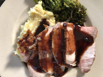 DOUBLE CUT PORK CHOPS WITH MARIONBERRY SAUCE AND SWEET POTATO-PARSNIP MASH