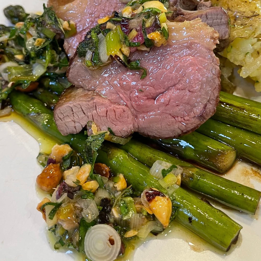 ROASTED LAMB, CRUSHED POTATOES, AND ASPARAGUS WITH CHARRED SPRING ONION AND HAZELNUT PESTO
