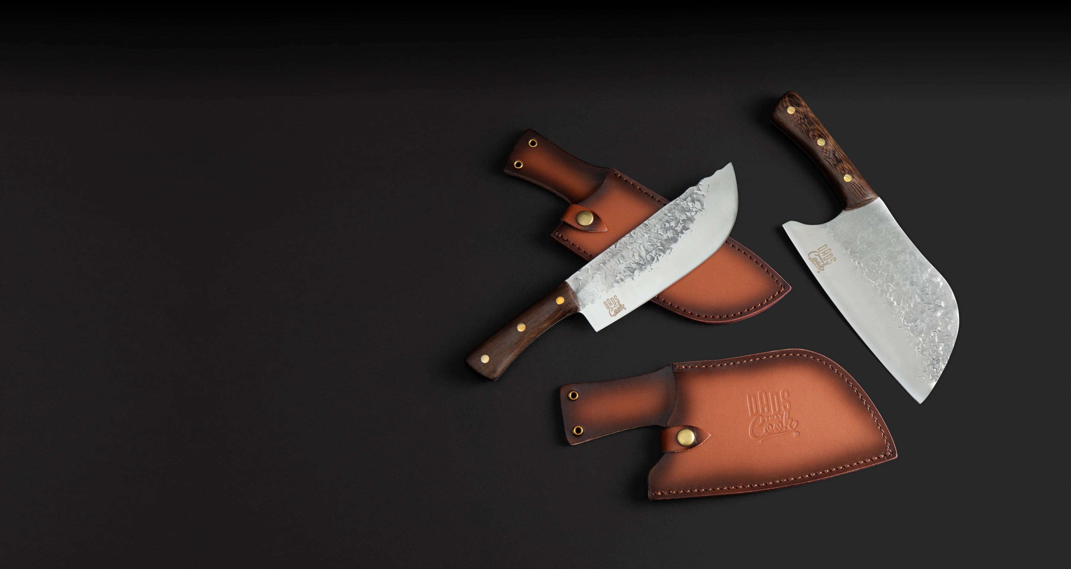 The Dads That Cook Chef knife and Cleaver Knife with leather sheaths on a dark background